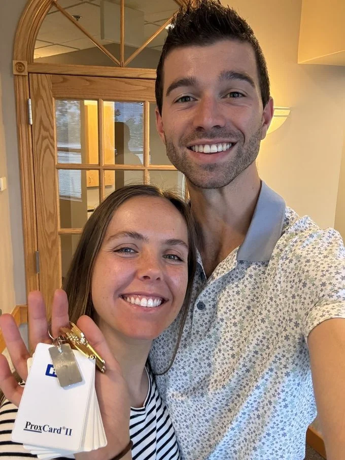Ryan and Devon Hofsess holding the keys to the new Rooted Dentistry practice.